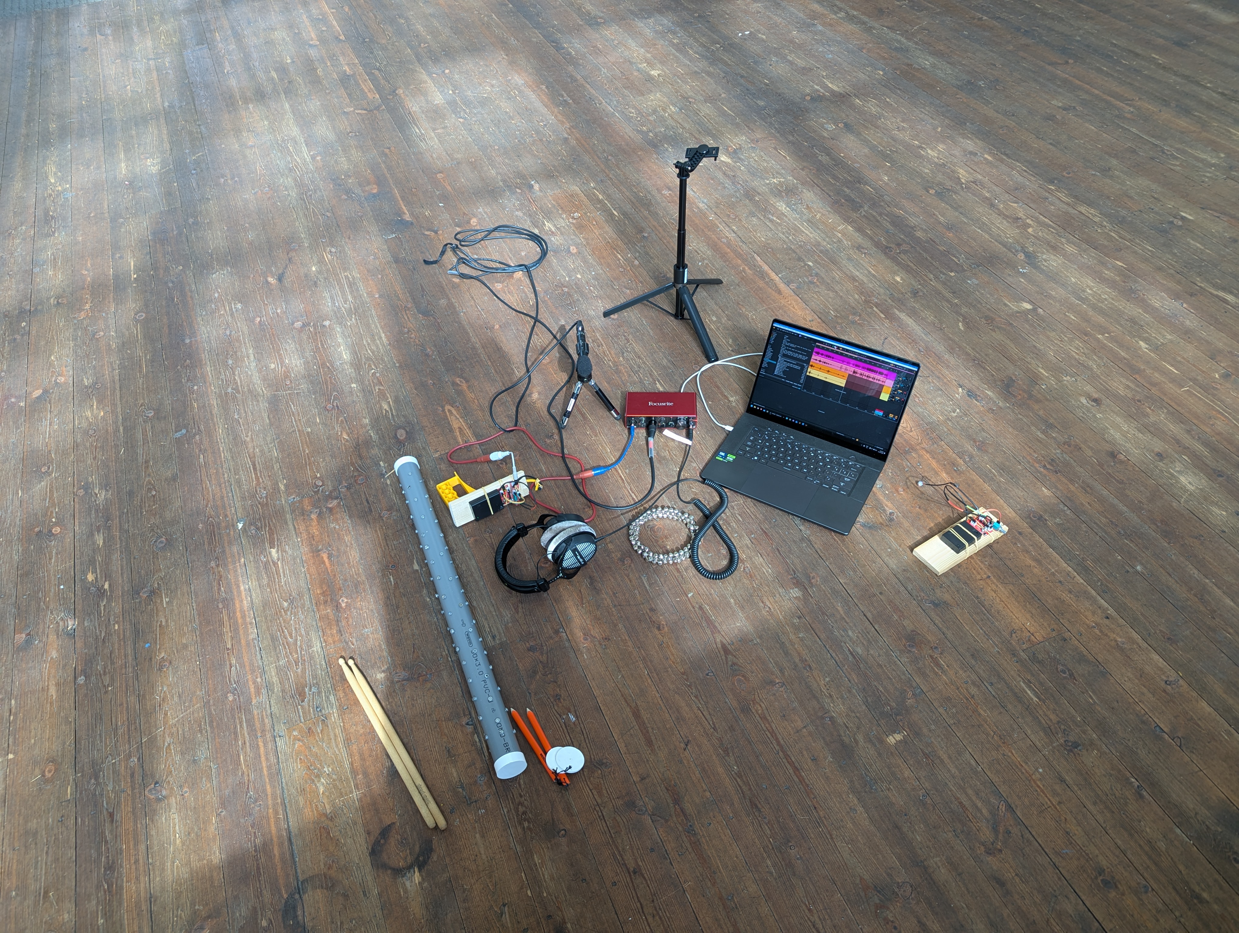 Gear laid out on the church floor for the same sound experiments.